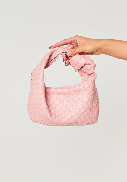 Pink woven bag on sale